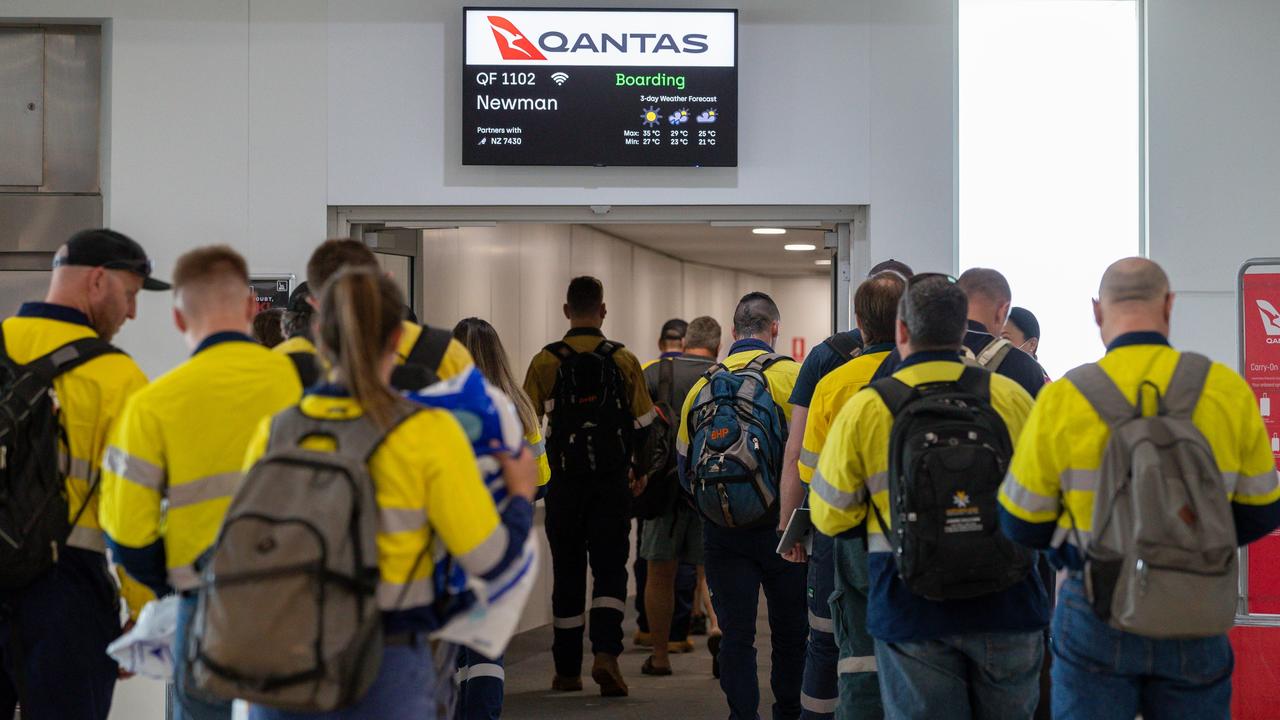 FIFO mine workers board a Qantas flight to Newman at Perth domestic airport. Picture: AAP