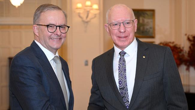 Australia's Prime Minister Anthony Albanese, left, shakes hands with Governor-General David Hurley after taking an oath at Government House in Canberra on Monday. Picture: Saeed Khan/AFP