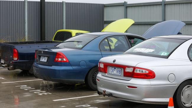 Cars lined up at Altona police station for their roadworthy checks. Picture: Brendan Beckett