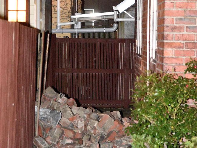 A chimney that collapsed into the yard of the Fiji High Commission is seen in Wellington early on November 14. Picture: AFP