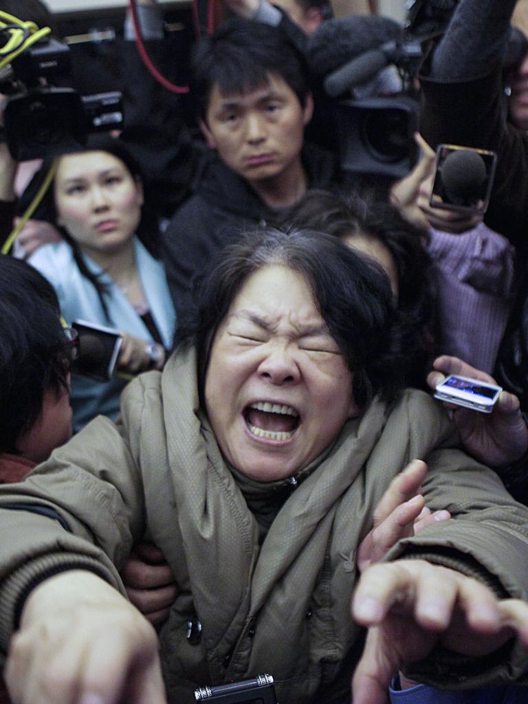 A family member of a passenger reacts to the aircraft’s disappearance in 2014. Picture: Visual China Group/Getty Images