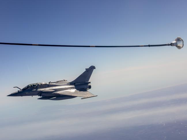 A French Rafale jet refuels mid-air about 100km south of Darwin. Picture: Floss Adams.