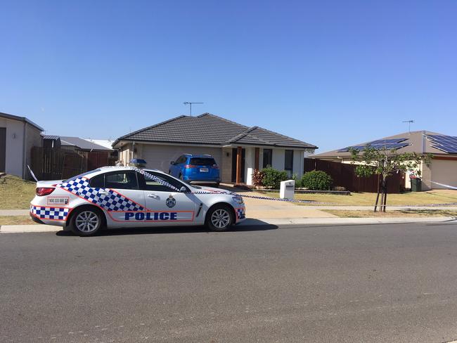 Police at the scene of the fatal shooting on Geoff Wilson Drive.