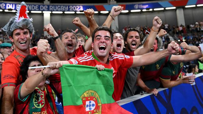 TOULOUSE, FRANCE - OCTOBER 08: Portugal fans celebrate their teams first ever World Cup victory after the Rugby World Cup France 2023 match between Fiji and Portugal at Stadium de Toulouse on October 08, 2023 in Toulouse, France. (Photo by Laurence Griffiths/Getty Images)