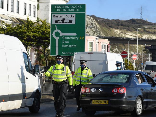 Police officers direct drivers queuing at the Port of Dover as the COVID-19 testing of drivers queuing to depart from the ferry terminal to Europe continues. Picture: AFP