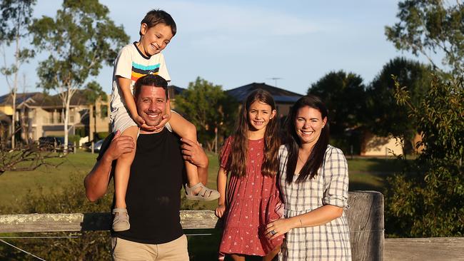 Pleased home owners Vince and Vanessa Polimeni with their children Luca, 5, and Mia, 7, at their home in Harrington Park, in Sydney’s southwest. Picture: Jane Dempster