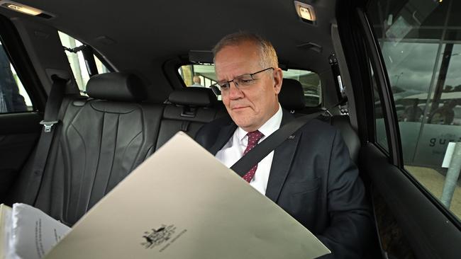 Scott Morrison has a rare quiet moment to himself in his official car following his interview with The Australian in Brisbane on Monday. Picture: Lyndon Mechielsen