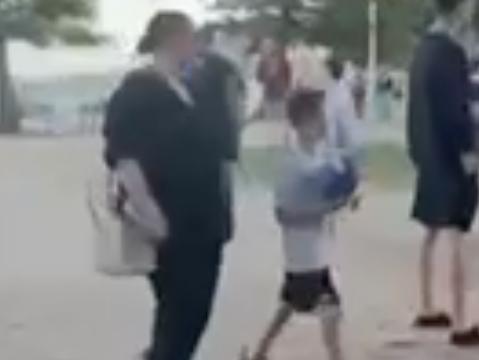 A woman and a child shout "f*** the Jews" after a pro-Palestinian rally in Sydney. Picture: the Australian Jewish Association.