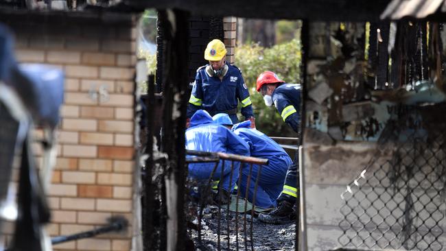 Fire investigators and forensic services at the scene of the tragedy. Picture: AAP/Mick Tsikas