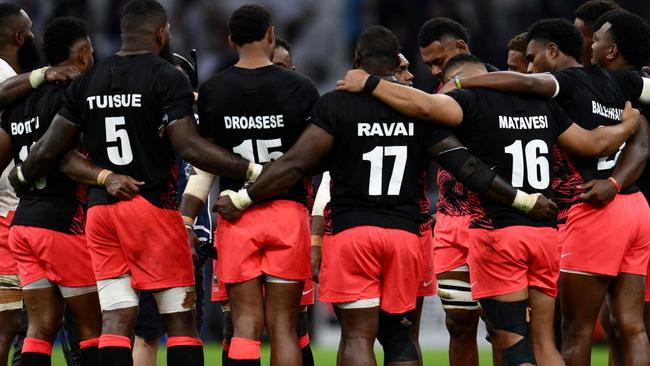 Fiji's players huddle after losing the France 2023 Rugby World Cup quarter-final match between England and Fiji at the Velodrome Stadium in Marseille, southeastern France, on October 15, 2023. (Photo by CHRISTOPHE SIMON / AFP)