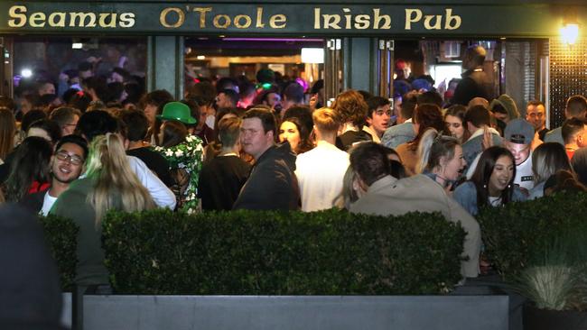 Some of the 1000-plus patrons queueing for what could have been their last night at The IrIsh. Picture: Stuart Milligan