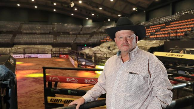 The Professional Bull Riders Cairns Invitational will be held on Saturday night at the Cairns Convention Centre. PBR General Manager Glenn Young looks out over the construction of the arena from the release shutes. Picture: Brendan Radke