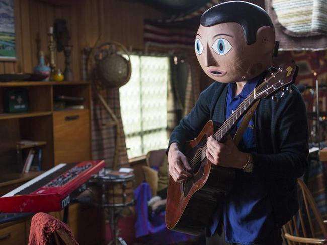 Michael Fassbender remains hidden under a giant papier-mache head throughout <i>Frank</i>.