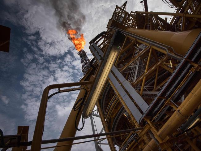 A view of the flare on the Kaombo Norte, a Floating Production Storage and Offloading vessel(FPSO), a project operated by Total, the French multinational oil company, on November 8, 2018, about 250km off the coast of Angola in the Atlantic Ocean. The flare is burning excess extracted that isn't used, but once the FPSO's gas system is fully operational, there will be very little or no flare. - A column of flame emanates from the bow of the boat, illuminating the jet-black ocean for miles around. For three months now the Kaombo Norte has been anchored off the northern coast of Angola and has recently begun to pump up crude oil secreted in the depths below. The arrival of the platform ship which belongs to French oil giant Total has been a timely lifeline for the Angolan government. (Photo by Rodger BOSCH / AFP)