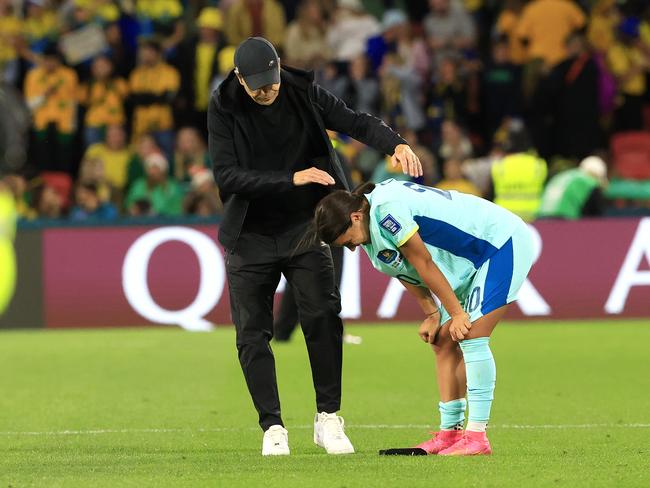 Coach Tony Gustavsson comforts Sam Kerr. Picture: Adam Head