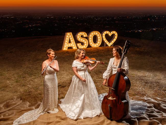 Adelaide Symphony Orchestra musicians Lisa Gill (flute), Emma Perkins (violin) and Belinda Kendall-Smith (double bass) on the Pioneer Women’s Trail in Beaumont. Hair and make-up by M&amp;CO Style Bar, dressed by Gretakate. Picture: Matt Turner.