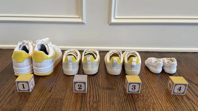 In another shot, Kerr shows four pairs of white shoes lined up against a wall.