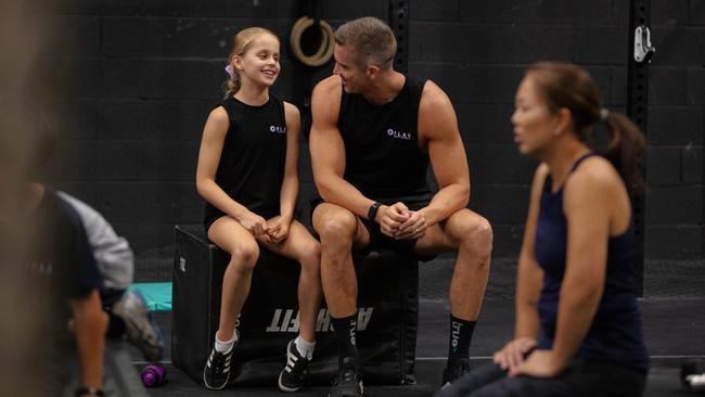 Luke Hogan and daughter Chloe during their workout at Crossfit Play. Picture: Adrian Fowler