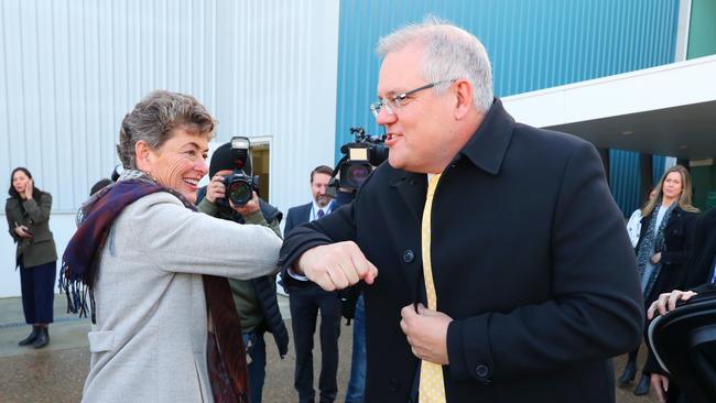 Liberal Eden-Monaro candidate Fiona Kotvojs and Scott Morrison share a campaign trail Covidian greeting. Picture: Adam Taylor / PMO