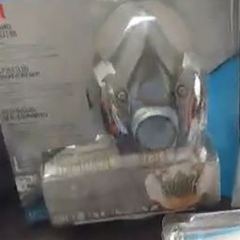 Dianne Regan couldn't stop herself from laughing as she bought a heavy-duty respiratory mask which she said looked straight out of a film. A screen grab from Mrs Regan’s video.