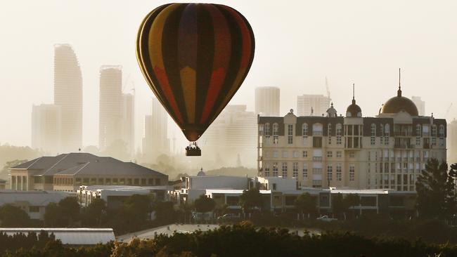 A balloon comes into land at Emerald Lakes, avoiding the spires on the French Quarter buildings, on Thursday morning. Once a common sight in the area, Balloons with their baskets full of tourists are now something of a rarity. Picture Glenn Hampson