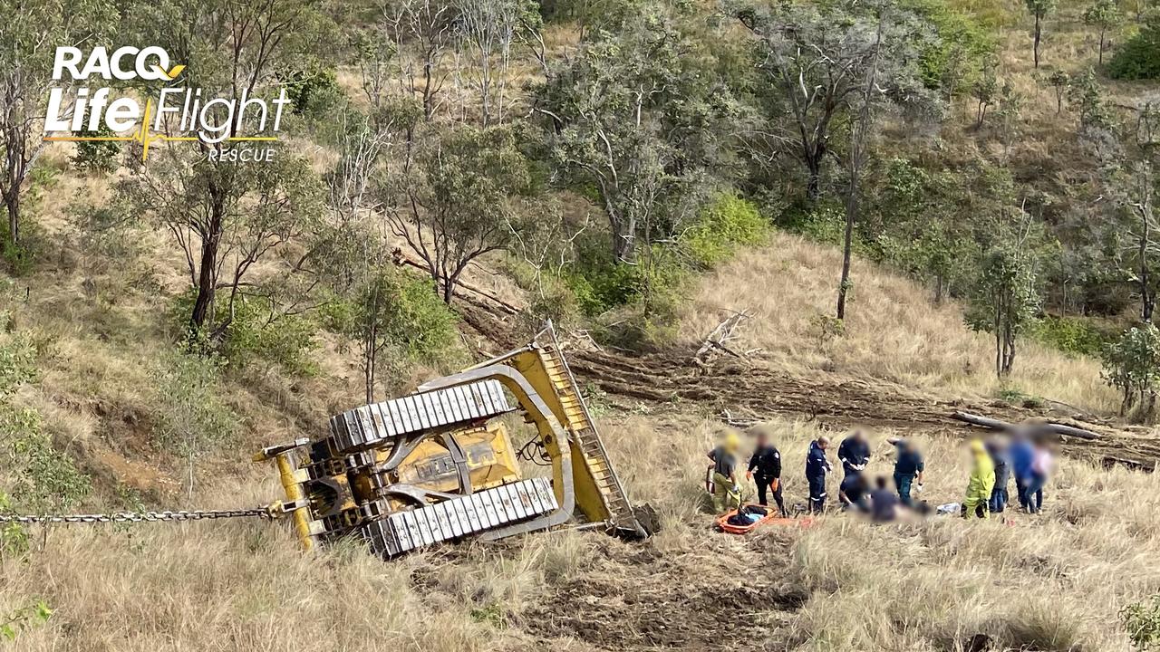 The Toowoomba-based RACQ LifeFlight Rescue helicopter has airlifted a man, who was injured when his bulldozer rolled down a steep mountainside at Booubyjan. Picture: RACQ LifeFlight