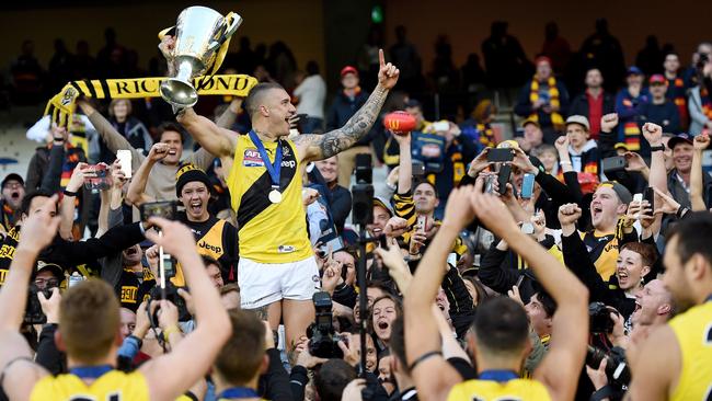 Dustin Martin celebrates with the Premiership Cupand Tiger Army in 2017. Picture. Nicole Garmston