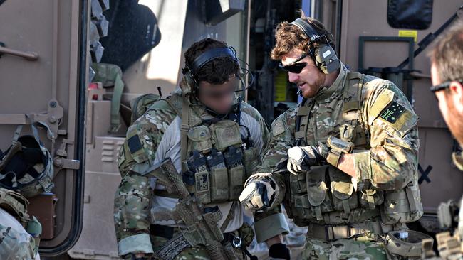 SAS Corporal Ben Roberts-Smith, (left of centre) with the Australian Special Operations Task Group prepares to deploy to the Shah Wali Kot Offensive, Afghanistan, in June 2010. Picture: Department of Defence