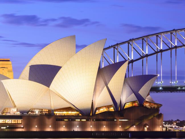 ESCAPE: Sydney, Australia - November, 21st 2012; Sydney Opera House and the Harbour Bridge illuminated at dusk. View across Farm Cove, looking west. Picture: Istock