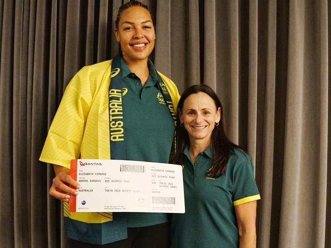 Opals coach Sandy Brondello presents star Liz Camage with her ticket to the Tokyo Olympics.