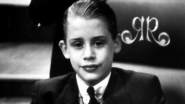 1994- Actor Macaulay Culkin (seated) & Jonathon Hyde in the film 