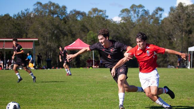 Gregory Terrace and Ipswich Grammar School First XI football action.