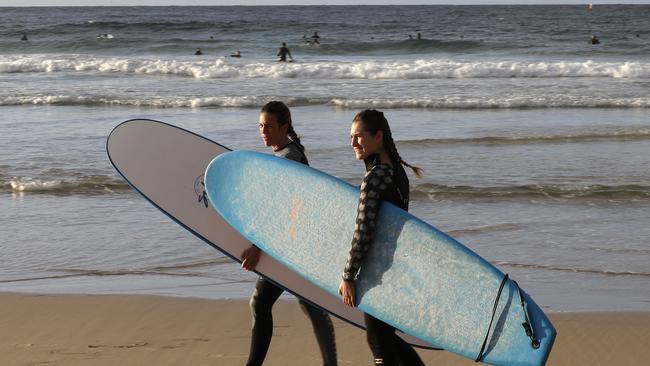 Surfers prepare to enter the water at Bondi Beach in Sydney. Picture: AP