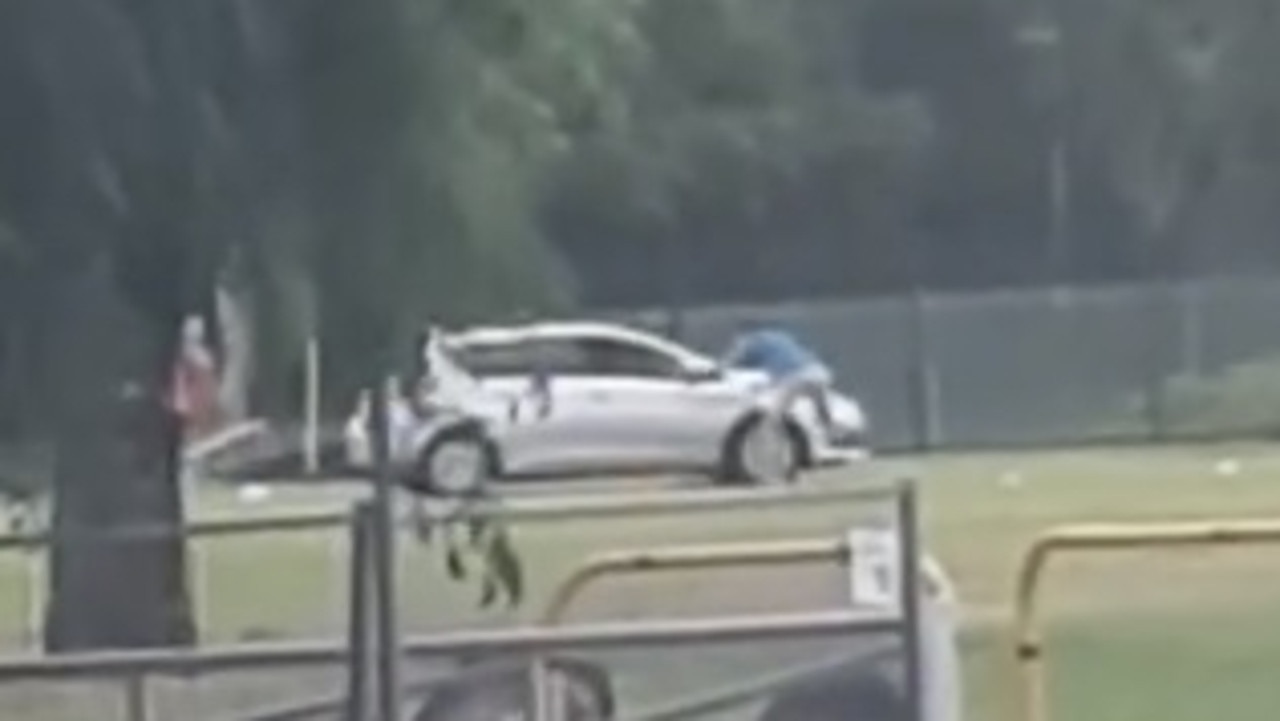 The Toyota Corolla was spotted driving at a sports player at the Burt St soccer fields in Aitkenvale. Picture: Supplied