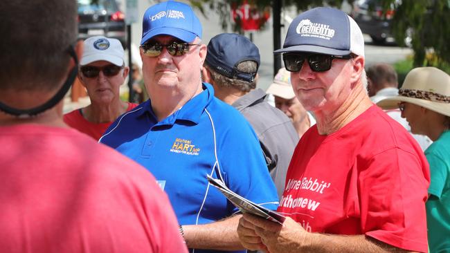 Candidate Wayne Bartholomew (ALP) and sitting member Michael Hart (Liberal) handing out how to vote cards. Picture Glenn Hampson