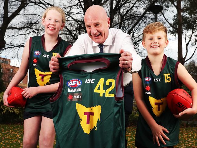 Premier Peter Gutwein with siblings Emily Apted 13 and Bailey Apted 8 of Midway Point.  Inspiring passion for Tassie footy ahead of the AFL game at Blundstone Arena.  Picture: Nikki Davis-Jones