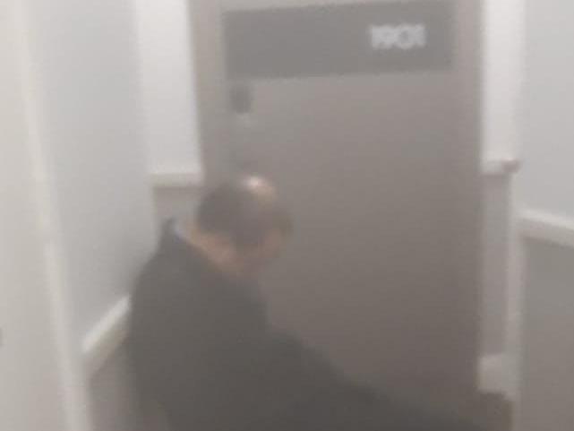 A private security guard seemingly asleep on the job at a Sydney hotel.