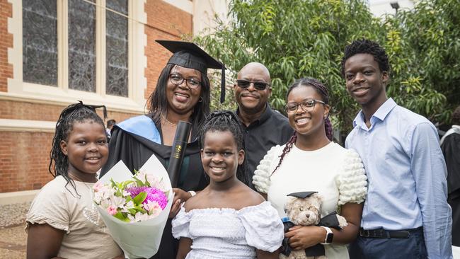 Bachelor of Human Services graduate Wendy Mbano celebrates with her kids (from left) Candice, Quanthea, Katelyn, Tawana and husband Leonard Mbano at a UniSQ graduation ceremony at Empire Theatres, Tuesday, February 13, 2024. Picture: Kevin Farmer