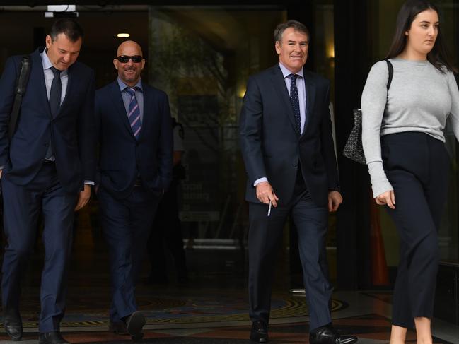 Wayne Geber (2nd left) leaves the Downing Centre Court with his legal team and an unknown woman. Picture: AAP Image/Joel Carrett