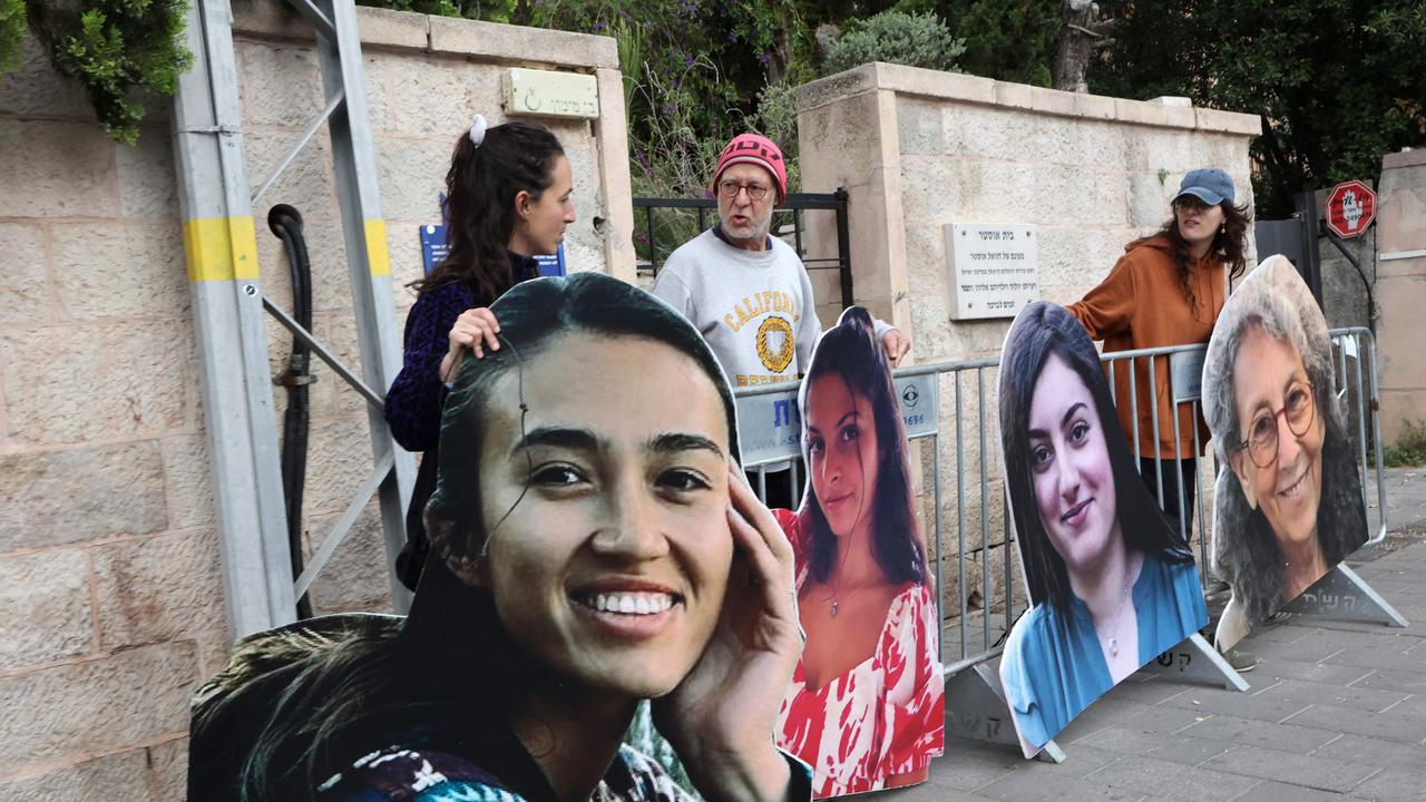 Relatives and supporters set up large cardboard cutout portraits of Israeli women held hostage in Gaza since the October 7 attacks, during a protest calling for their release in front of the Prime Minister's residence in Jerusalem on May 2, 2024. (Photo by GIL COHEN-MAGEN / AFP)