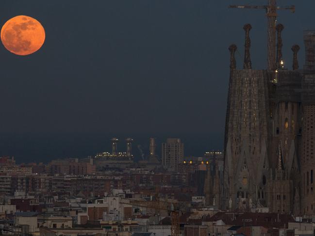 Barcelona’s Sagrada Familia Basilica is backdropped by a super blue blood moon in Barcelona, Spain, Wednesday, Jan. 31, 2018. On Wednesday, much of the world will get to see not only a blue moon which is a supermoon, but also a lunar eclipse, all rolled into one celestial phenomenon. Picture: AP