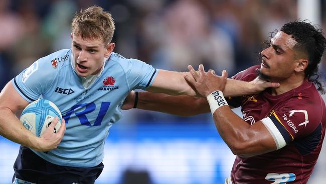 Max Jorgensen holding off a Highlanders player in Super Rugby Pacific. Picture: Mark Metcalfe/Getty Images