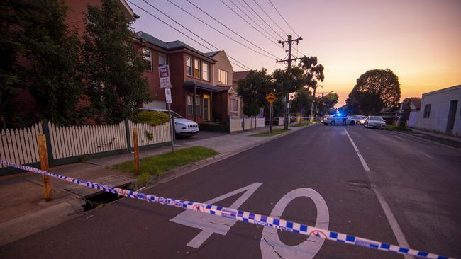 Police examine the scene close to where a man was stabbed. Picture: Jay Town