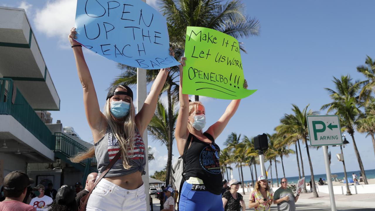 Bartenders hold signs during a ‘Right to Work’ rally. Picture: Lynne Sladky/AP