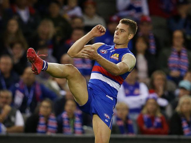 Western Bulldogs midfielder Josh Dunkley kicks at goal.