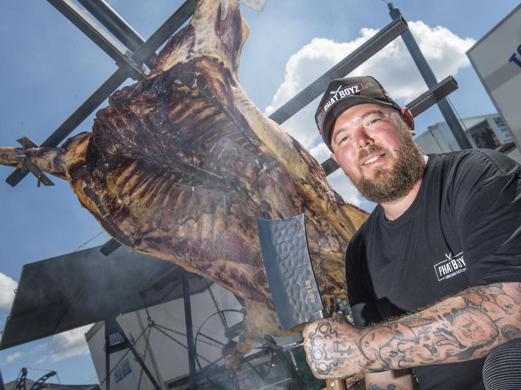 Luke Moonshine from Phat Boyz with a 240kg beast on an Asado Cross to cook for 36 hours. Meatstock 2023 at Toowoomba Showgrounds. Friday, April 14, 2023. Picture: Nev Madsen.