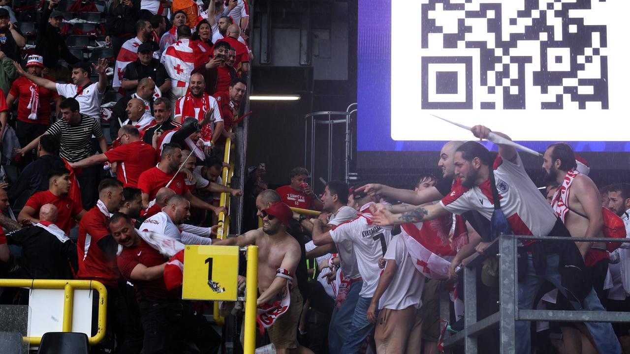 Fans came together before the match. (Photo by Dean Mouhtaropoulos/Getty Images)