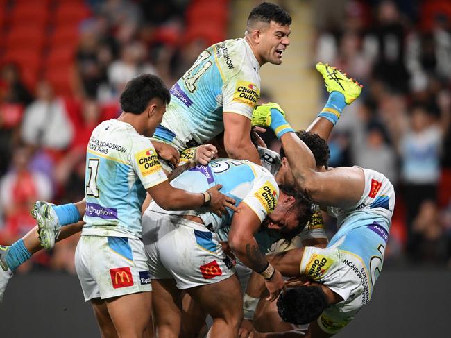 BRISBANE, AUSTRALIA - JULY 28: Klese Haas of the Titans celebrates scoring a try with team mates during the round 21 NRL match between Dolphins and Gold Coast Titans at Suncorp Stadium, on July 28, 2024, in Brisbane, Australia. (Photo by Matt Roberts/Getty Images)