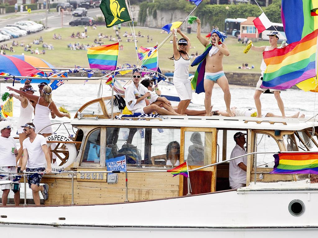 Highly decorated boats and people spending Australia Day on Sydney Harbour. Picture: Jenny Evans