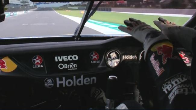 Shane van Gisbergen stretching and relaxing his arms and hands during Race 9.